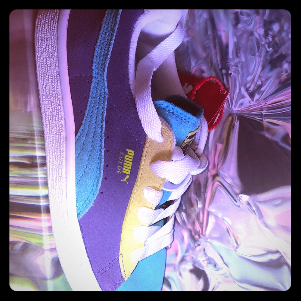 Teal purple and green Puma.